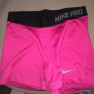 Pink Nike pro shorts w black band